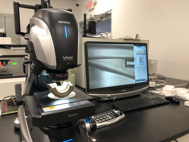 Keyence VHX-700 Digital Microscope with Glass Mold neck ring on stage
